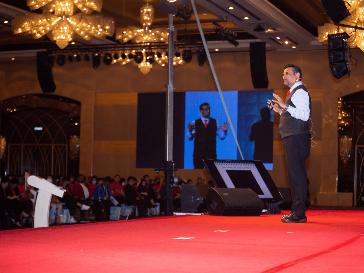Suresh Dhawan presenting at an event